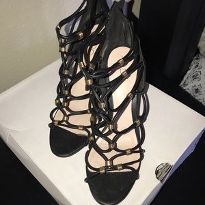 Black strapped heel with gold studs